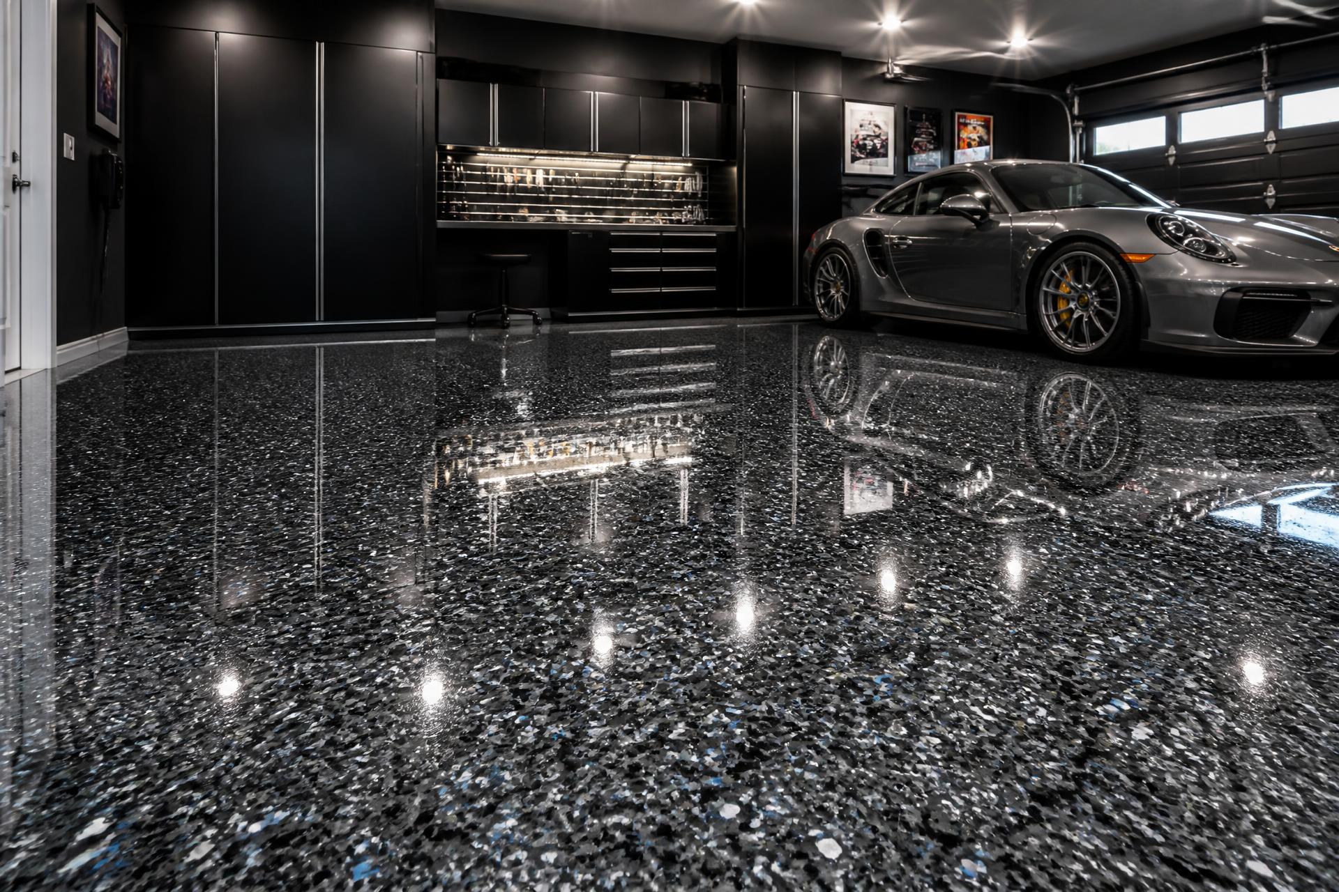 Glossy silver and charcoal flake epoxy garage floor installed in a Connecticut home garage